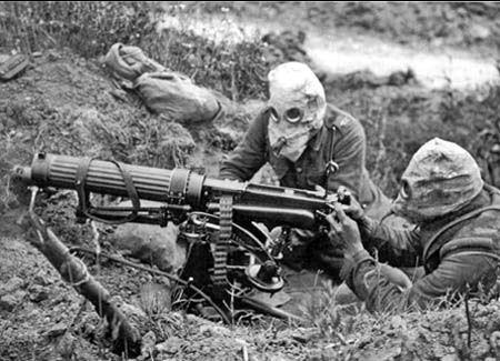 Machine gun crew with gas masks